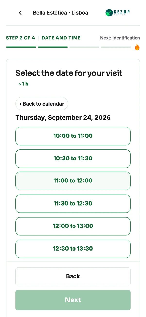 Phone showing the public booking page for the Lisbon location, with appointment times displayed in Lisbon time